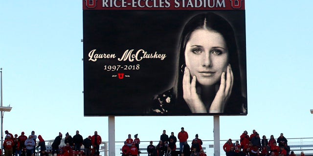 In this Nov. 10, 2018, photo, a photograph of University of Utah student and track athlete Lauren McCluskey, who was fatally shot on campus, is projected on the video board before the start of an NCAA college football game between Oregon and Utah in Salt Lake City. (AP Photo/Rick Bowmer, File)