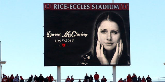 In this Nov. 10, 2018, photo, a photograph of University of Utah student and track athlete Lauren McCluskey, who was fatally shot on campus, is projected on the video board before the start of an NCAA college football game between Oregon and Utah in Salt Lake City. (AP Photo/Rick Bowmer, File)