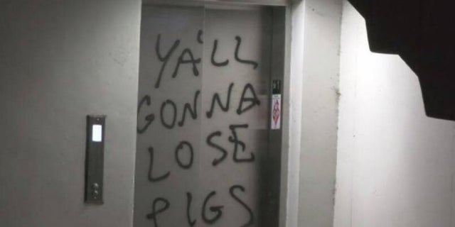 Protesters vandalized a Los Angeles Police Department station in August 2021, spray-painting anti-police slogans and burning an American flag, authorities said. 