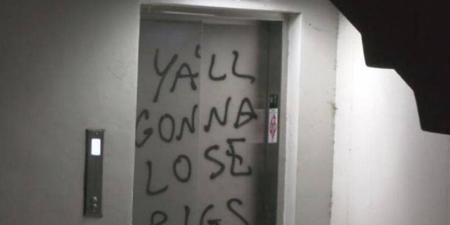 Protesters vandalized a Los Angeles Police Department station in August 2021, spray-painting anti-police slogans and burning an American flag, authorities said.
