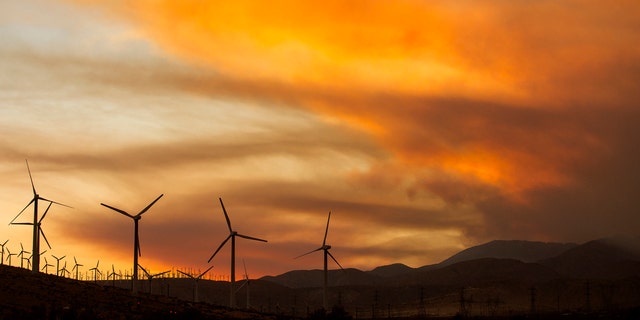 Smoke rise from the Apple Fire during the sunset near Whitewater, Calif., Sunday, Aug. 2, 2020.