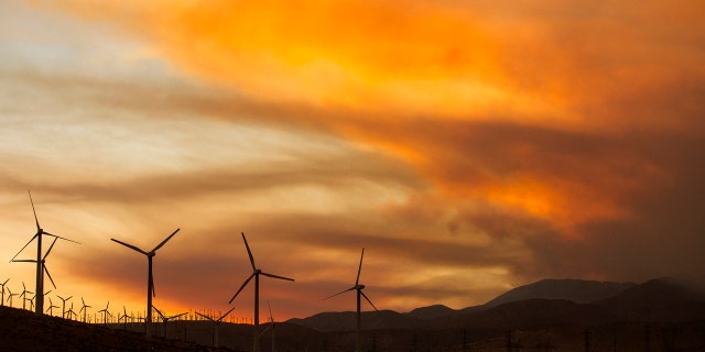 Smoke rise from the Apple Fire during the sunset near Whitewater, Calif., Sunday, Aug. 2, 2020.