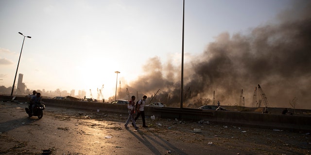 A smoke from a massive explosion is seen in in Beirut, Lebanon, Tuesday, Aug. 4, 2020. Massive explosions rocked downtown Beirut on Tuesday, flattening much of the port, damaging buildings and blowing out windows and doors as a giant mushroom cloud rose above the capital. Witnesses saw many people injured by flying glass and debris.