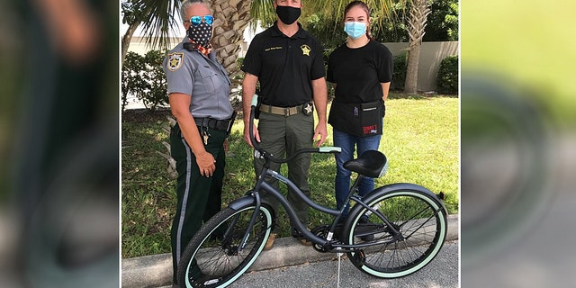 Traffic Crash Investigator Susie Dorio, Major Brian Hester and Nikki with the new wheels, pictured.