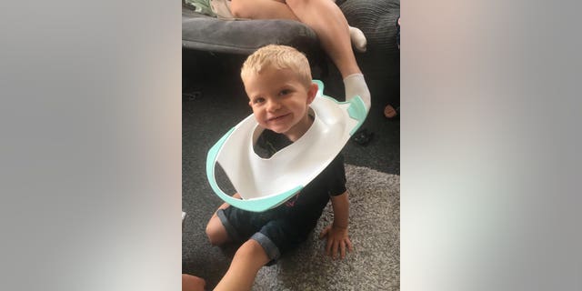 Callum Souch had to be rescued by firefighters after getting his head stuck in a toilet seat. (Credit: SWNS)