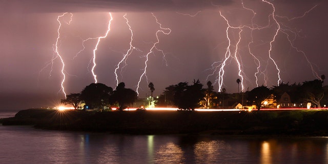 A rare lightning storm crackles over Mitchell's Cove in Santa Cruz, California around 3 a.m. Sunday morning August 16, 2020.