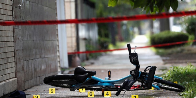 Chicago Police shell casing markers are seen, where a 37-year-old man riding a bicycle was shot and pronounced dead at the hospital, at the West Side of Chicago, Illinois, U.S., July 26, 2020. (REUTERS/Shannon Stapleton)
