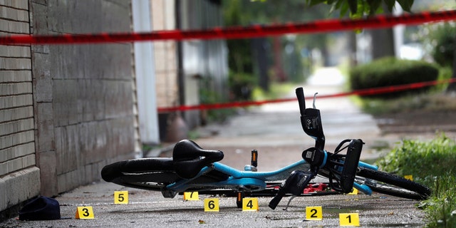 Chicago Police shell casing markers are seen, where a 37-year-old man riding a bicycle was shot and pronounced dead at the hospital, at the West Side of Chicago, Illinois, U.S., July 26, 2020. (REUTERS/Shannon Stapleton)