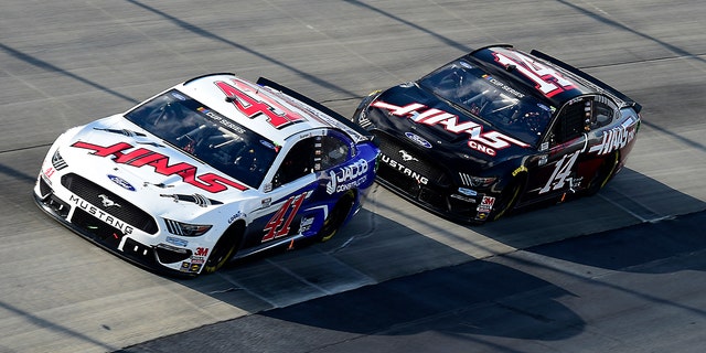 Custer leading Stewart-Haas teammate Clint Bowyer in the Drydene 311.