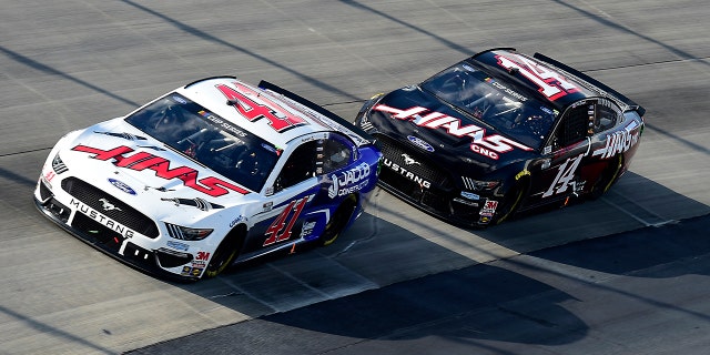 Custer leading Stewart-Haas teammate Clint Bowyer in the Drydene 311.