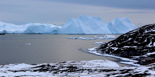 Icebergs near Greenland form from ice that has broken off--or calved--from glaciers on the island. A new study shows that the glaciers are losing ice rapidly enough that, even if global warming were to stop, Greenland's glaciers would continue to shrink. (Credit: Michalea King)