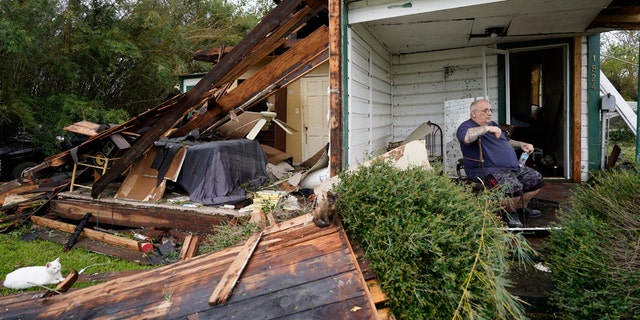 Chris Johnson views destruction at his home on Thursday, Aug. 27, 2020, in Lake Charles, La., after Hurricane Laura moved through the state. Johnson stayed in his home as the storm passed. (AP Photo/Gerald Herbert)