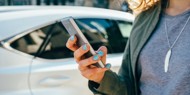 File photo of a woman using a smart phone.