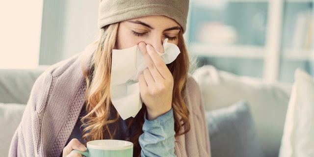 A woman is suffering from a cold. Fox News contributor Dr. Marc Siegel said: "When masks were removed and children began to socialize more, we began to see more of these infections, even out of season. [over the summer]some are mild, others are more severe."