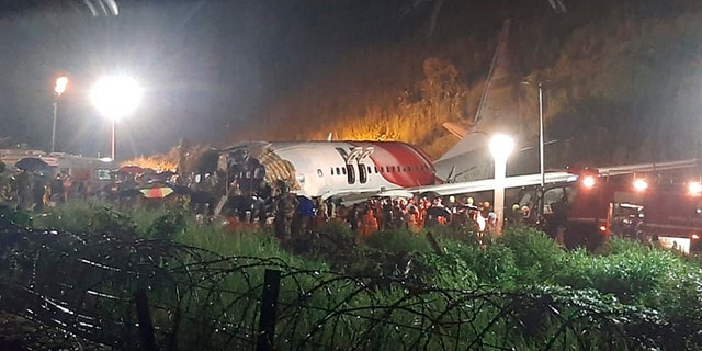 The Air India Express flight that skidded off a runway while landing at the airport in Kozhikode, Kerala state, India, Friday, Aug. 7, 2020. (Associated Press)
