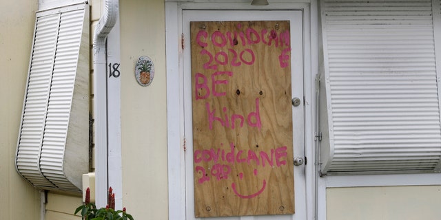 A boarded-up home is shown, Saturday, Aug. 1, 2020, in Briny Breezes, Fla.