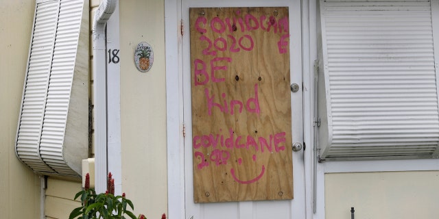 A boarded-up home is shown, Saturday, Aug. 1, 2020, in Briny Breezes, Fla.