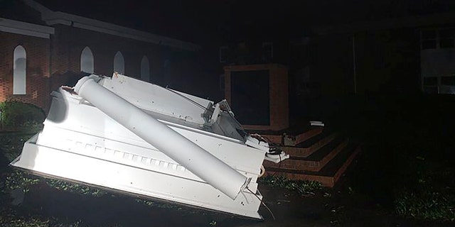 A bell tower toppled outside of Southport Baptist Church in Southport, N.C. as hurricane Isaias moved through North Carolina on Tuesday, Aug. 4, 2020.