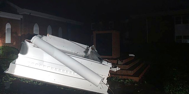 A bell tower toppled outside of Southport Baptist Church in Southport, N.C. as hurricane Isaias moved through North Carolina on Tuesday, Aug. 4, 2020.