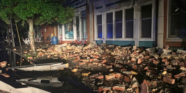 Debris covers the sidewalk in Southport, N.C. as hurricane Isaias moved through North Carolina early Tuesday, Aug. 4, 2020.