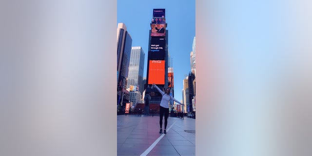 Julie Sullivan pauses for a photo in Times Square. (Photo credit: Julie Sullivan)