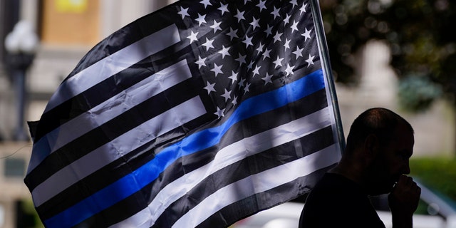 An unidentified man participating in a Blue Lives Matter rally Sunday in Kenosha, Wis.