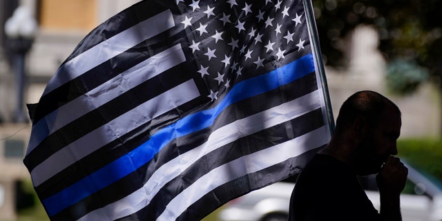 An unidentified man participating in a Blue Lives Matter rally Sunday in Kenosha, Wis.