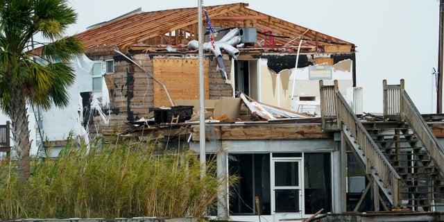 A damaged home in Hackberry, La., on Friday after Hurricane Laura moved through the area. (AP Photo/David J. Phillip)