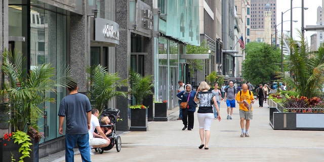 People walk the famous Magnificent Mile of Michigan Avenue in Chicago. It is Chicago's major shopping destination and one of USA's most recognized shopping areas. (iStock)