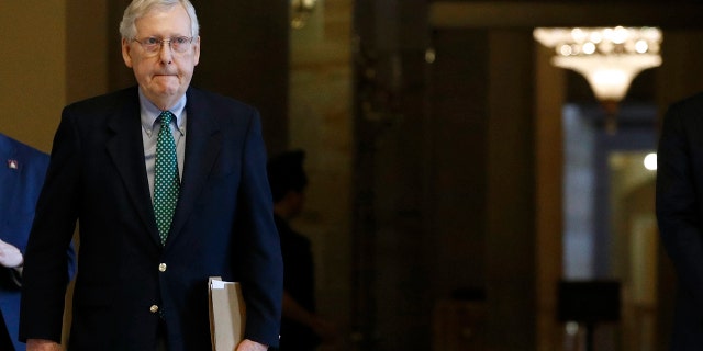 Senate Majority Leader Mitch McConnell of Ky. walks to the Senate Chamber on Capitol Hill in Washington, Monday, March 16, 2020. (AP Photo/Patrick Semansky)