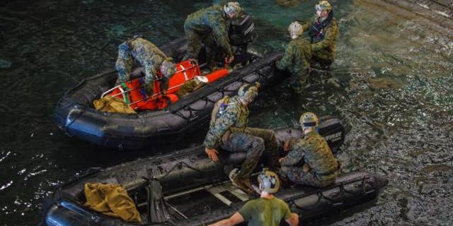 U.S. Marines and U.S. Navy sailors take part in a search for the remains of eight fellow service members off the coast of California. (15th Marine Expeditionary Unit)