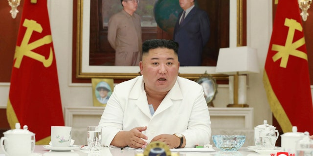 In this photo provided by the North Korean government, North Korean leader Kim Jong Un, presides over an executive policy council meeting on Aug. 5, 2020.