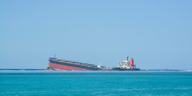 The MV Wakashio, a bulk carrier ship that recently ran aground off the southeast coast of Mauritius, can bee seen from the coast or Mauritius, Wednesday Aug. 12, 2020.