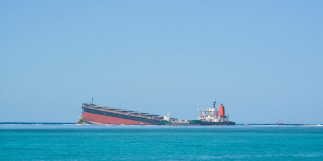 The MV Wakashio, a bulk carrier ship that recently ran aground off the southeast coast of Mauritius, can bee seen from the coast or Mauritius, Wednesday Aug. 12, 2020.