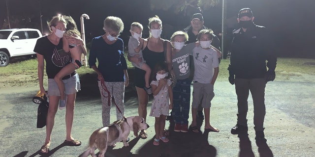 A group of nine people and their dog were rescued overnight from Oak Island as the hurricane roared ashore.