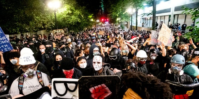 Black Lives Matter protesters march through Portland after rallying at the Mark O. Hatfield United States Courthouse on Sunday. (AP)