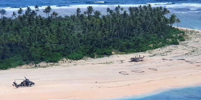 In this photo provided by the Australian Defence Force, an Australian Army ARH-90 Tiger Helicopter lands on Pikelot Island in the Federated States of Micronesia where three men were found safe and healthy on Sunday, Aug. 2, 2020, after missing for three days. (Australian Defense Force)