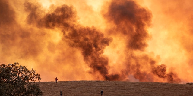 Wildfires advance in Almonaster la Real in Huelva, Spain, Thursday Aug. 27, 2020.