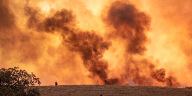 Wildfires advance in Almonaster la Real in Huelva, Spain, Thursday Aug. 27, 2020.