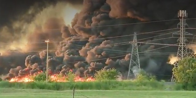 Explosions from the fire could be heard in the distance.