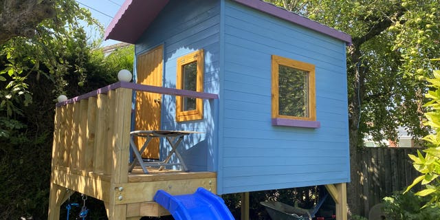 The eight-foot by six-foot playhouse was built in Jason Kneen's garden during lockdown. (Credit: SWNS)