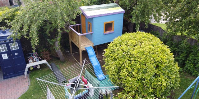 A child's playhouse was listed on Airbnb as a joke by dad-of-five, Jason Kneen, but it was actually booked. (Credit: SWNS)