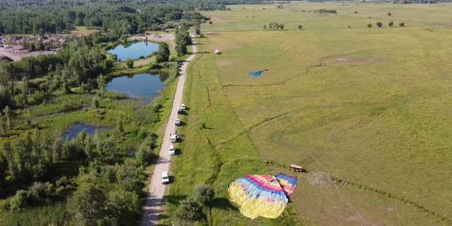 In this Monday, Aug. 3, 2020, file photo, two of three sightseeing balloons that crashed are seen in an open area of Jackson Hole in western Wyoming.