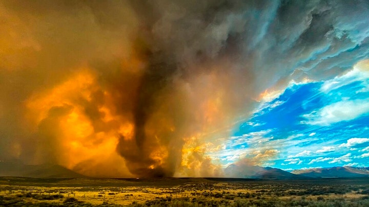 Firenado rips through parts of California, firefighters struggle to remove cars from a highway