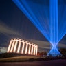 The sky above Calton Hill is lit up by My Light Shines On, an outdoor light installation for the 2020 Edinburgh International Festival, Aug. 7. 