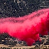 An air tanker drops fire retardant at the Apple Fire in Cherry Valley, California, Aug. 1, 2020. 