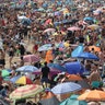People enjoy the hot weather on the beach in Bournemouth, England, Aug. 8, 2020. 