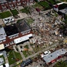Debris and rubble cover the ground in the aftermath of an explosion in Baltimore, Aug. 10, 2020. 