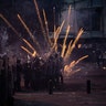 Fireworks thrown by anti-government protesters explode during clashes near the parliament building in Beirut, Lebanon, Aug. 10, 2020. 