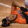 Baltimore Orioles' Pedro Severino grimaces after getting hit by a pitch during the ninth inning of the team's baseball game against the Washington Nationals in Washington, Aug. 8, 2020. 